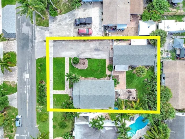 an aerial view of a house with a swimming pool