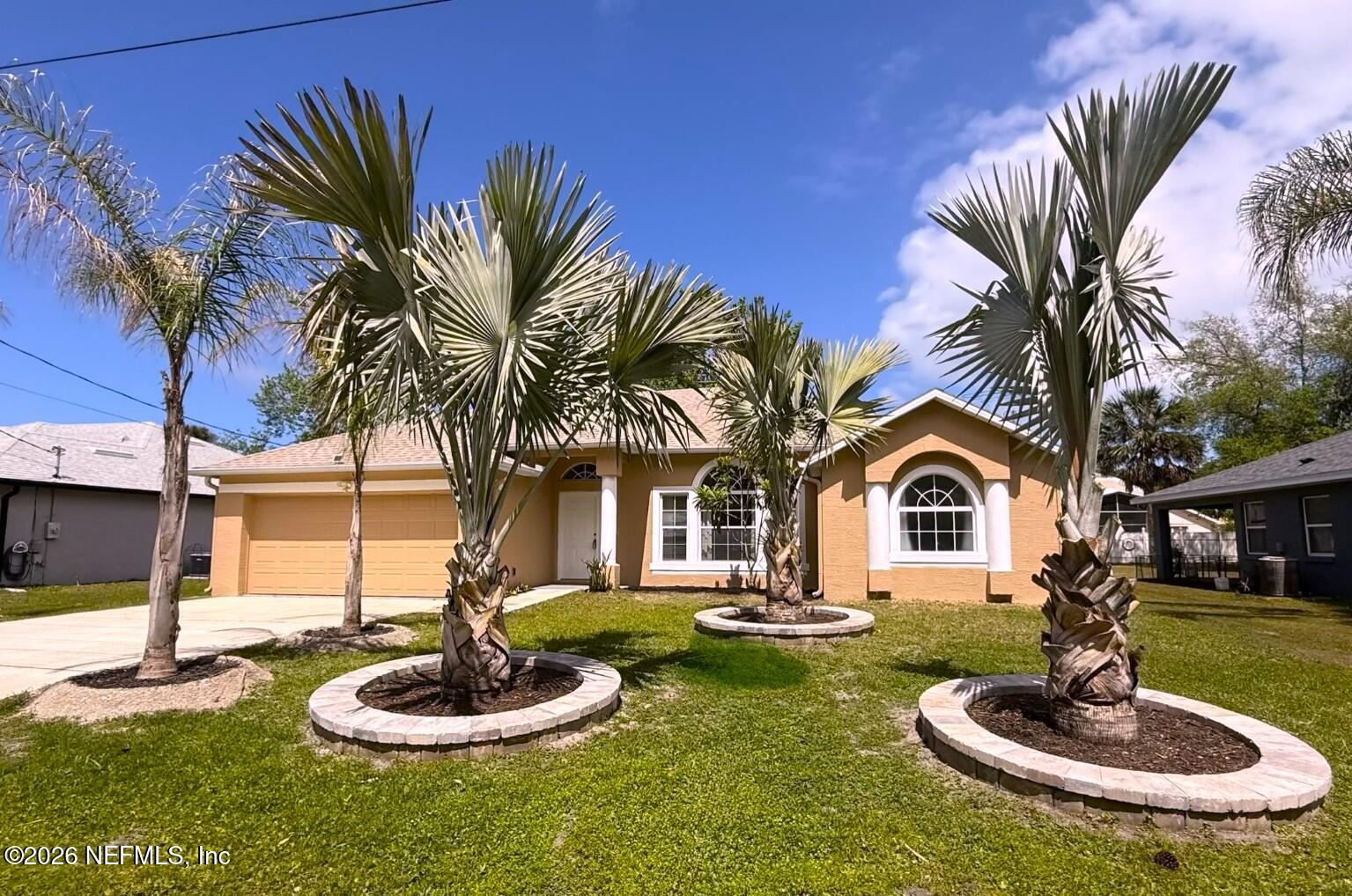 33 Phoenix Lane Palm Coast, FL 32164 - Photo 65 of 65 33 Phoenix trim palms