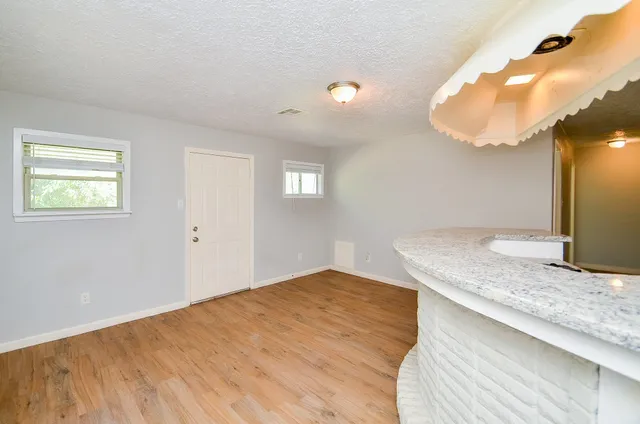 wooden floor with cabinet