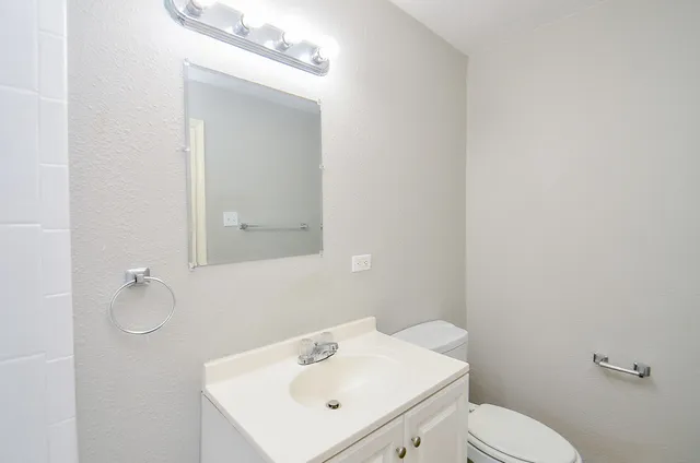 a bathroom with a sink a mirror and a bathtub