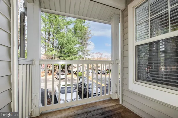 a view of a balcony with wooden floor