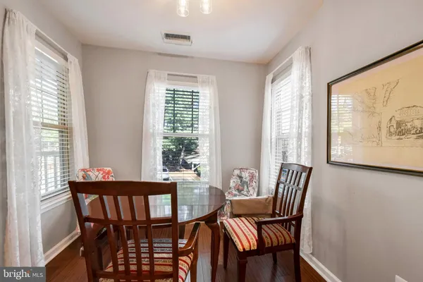 a view of a dining room with furniture large window and outside view