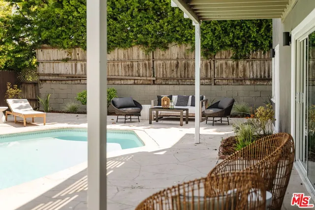 a kitchen with stainless steel appliances a stove sink and cabinets