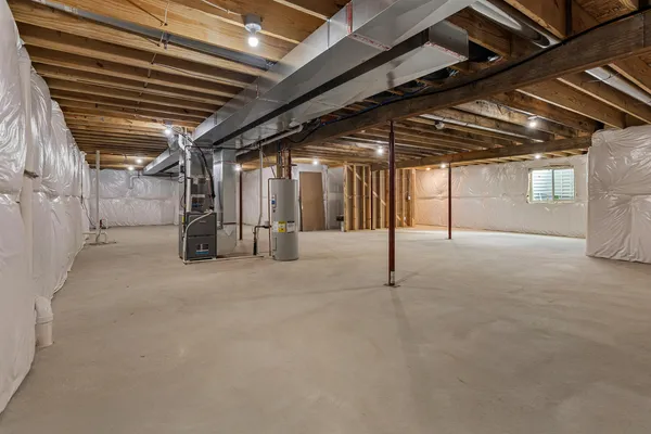 a view of a house with a wooden space and a road