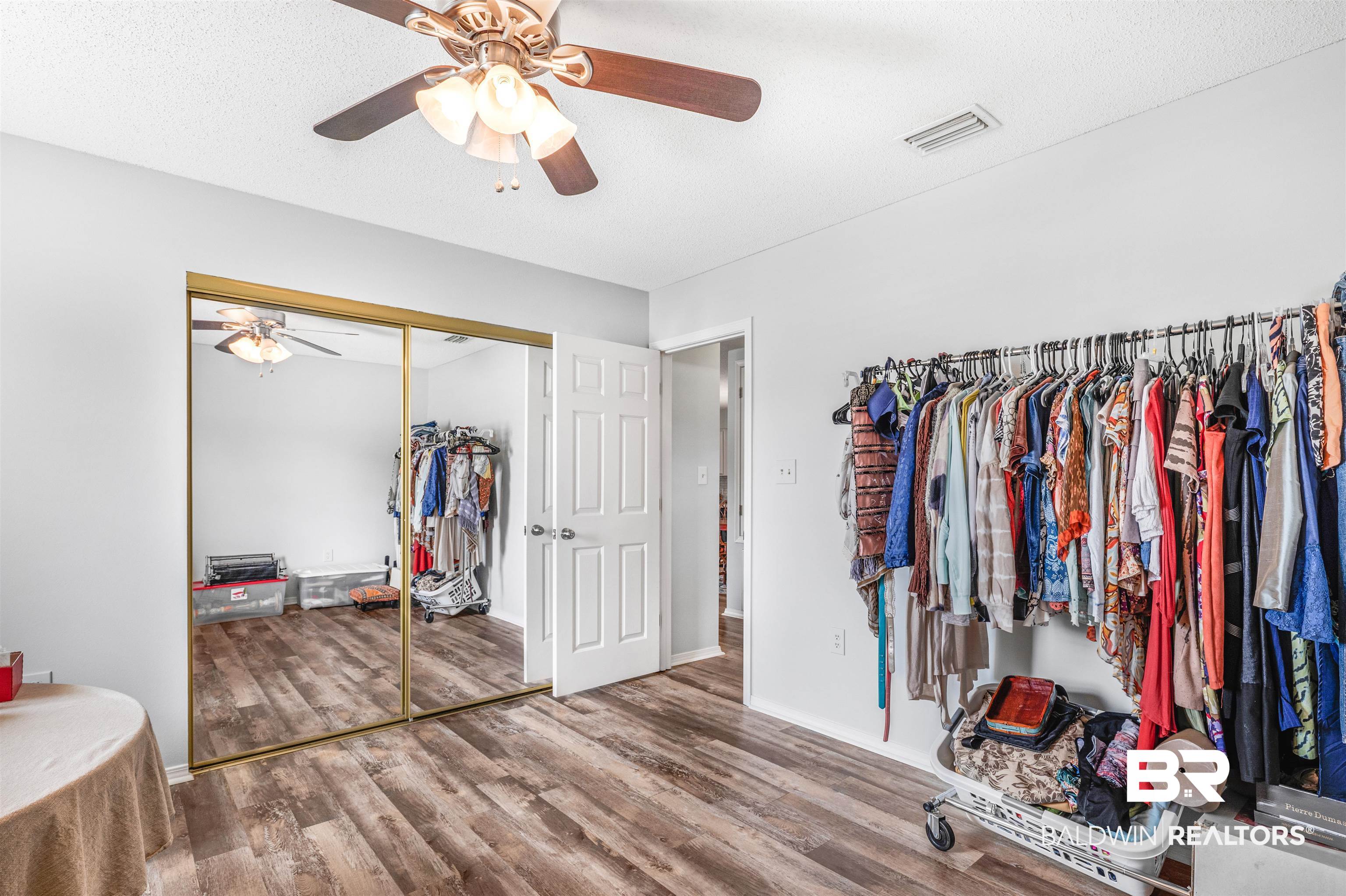 518 Ariel Avenue Foley, AL 36535 - Photo 24 of 47 Spacious closet featuring ceiling fan and wood-type flooring