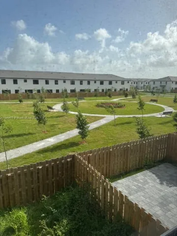 a view of a swimming pool and an outdoor space