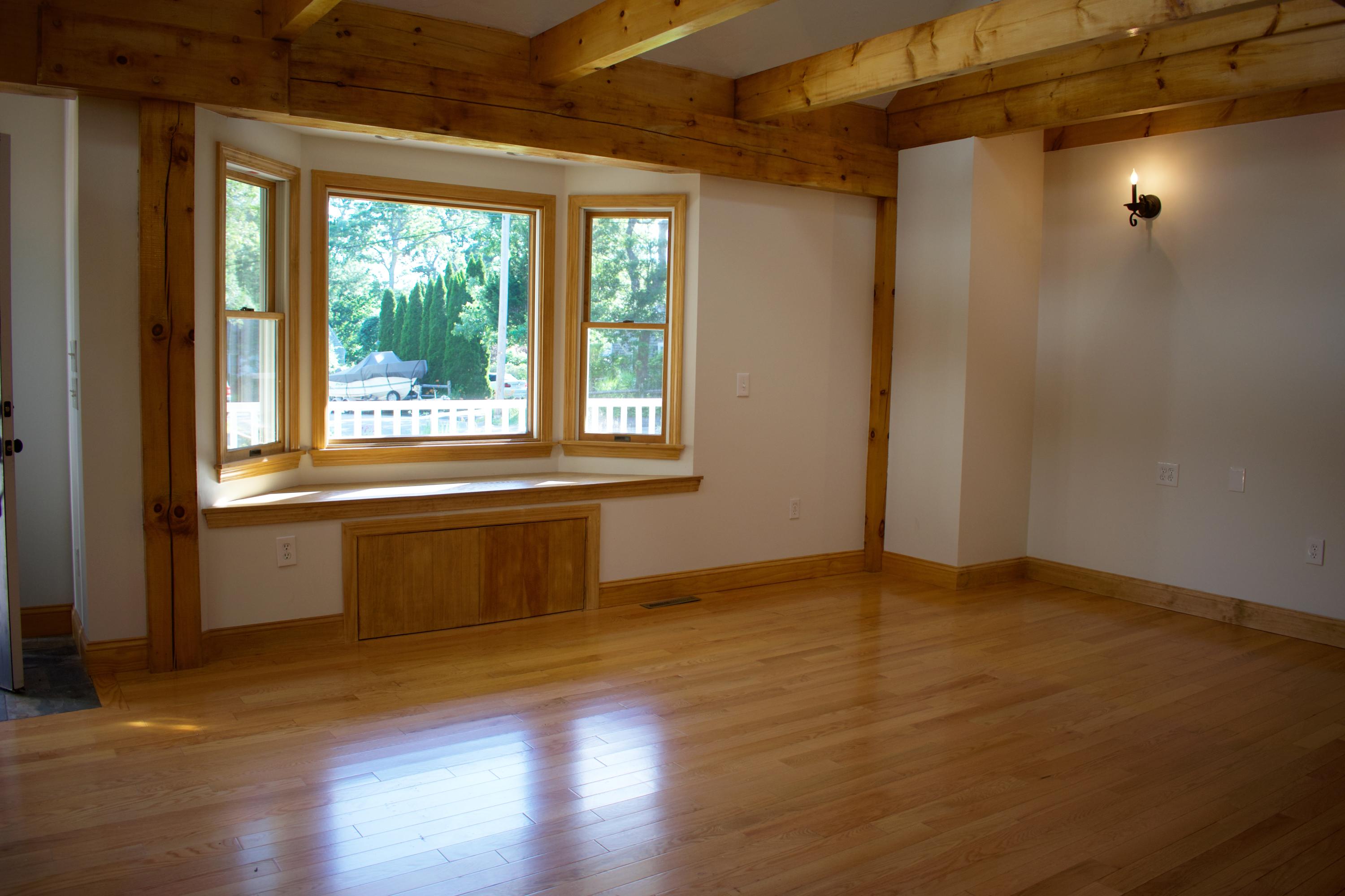 454 Old Town Road Hyannis, MA 02601 - Photo 6 of 36 an empty room with wooden floor and windows