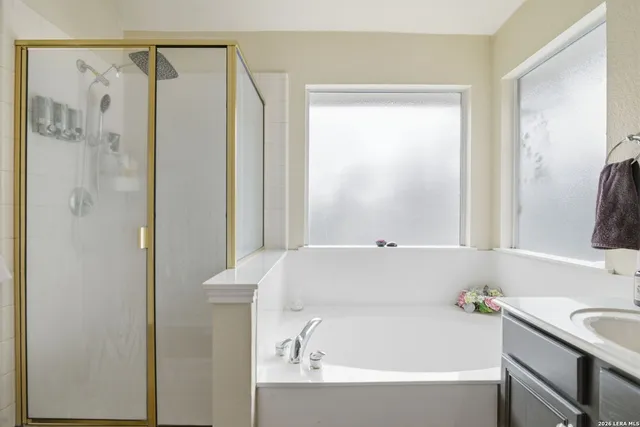 a bathroom with a double vanity sink mirror and