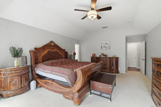 a living room with a table tennis pool table and furniture
