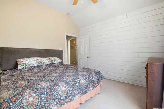 a bathroom with a shower sink vanity and mirror