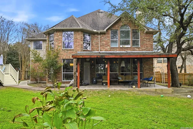 a view of a backyard with sitting area