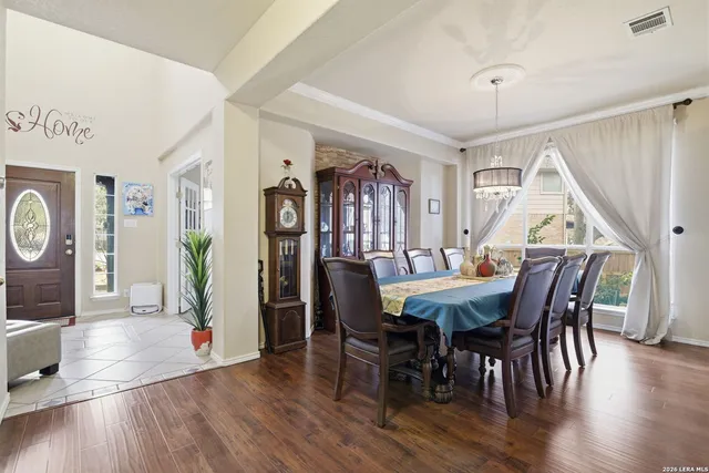 a view of a dining room with furniture window and wooden floor