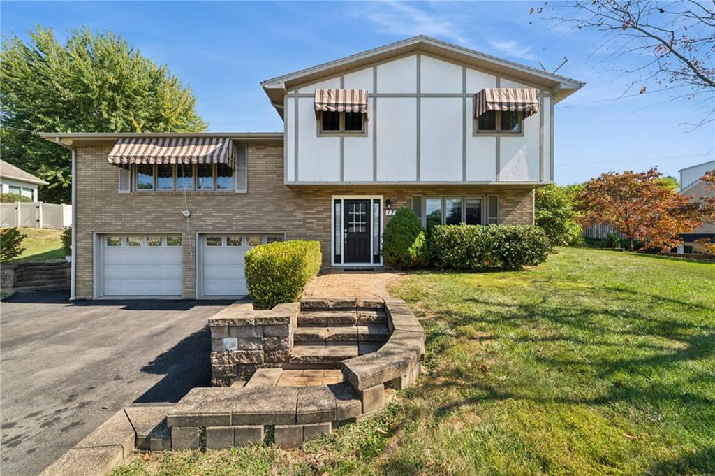 1722 Arona Road Irwin, PA 15642 - Photo 2 of 33 a house view with a garden space