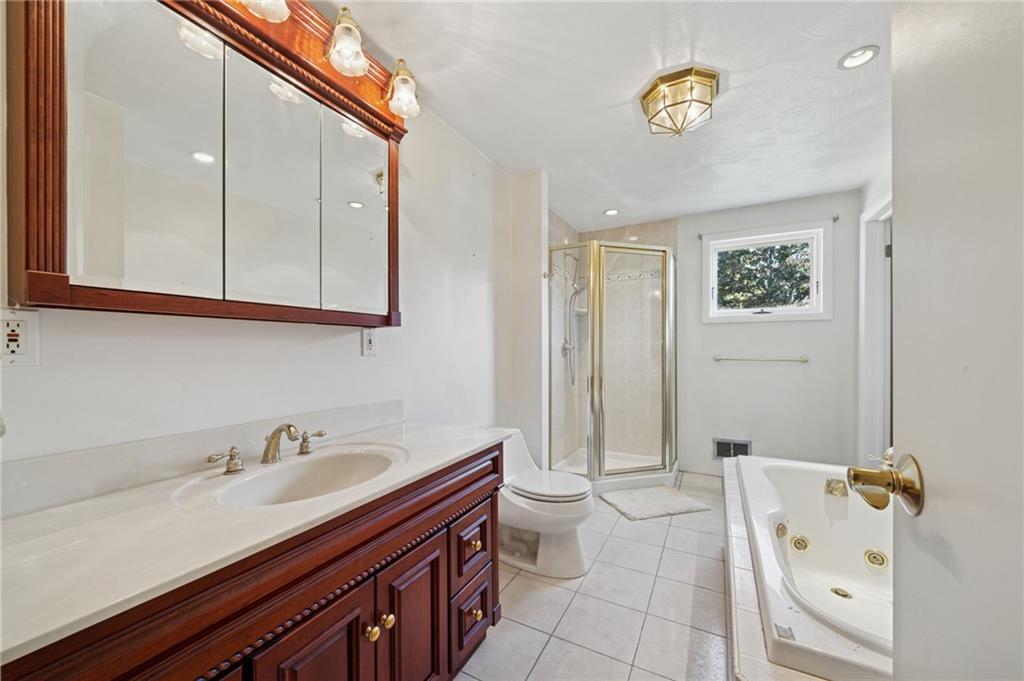 1722 Arona Road Irwin, PA 15642 - Photo 21 of 33 a bathroom with a granite countertop sink mirror vanity and toilet