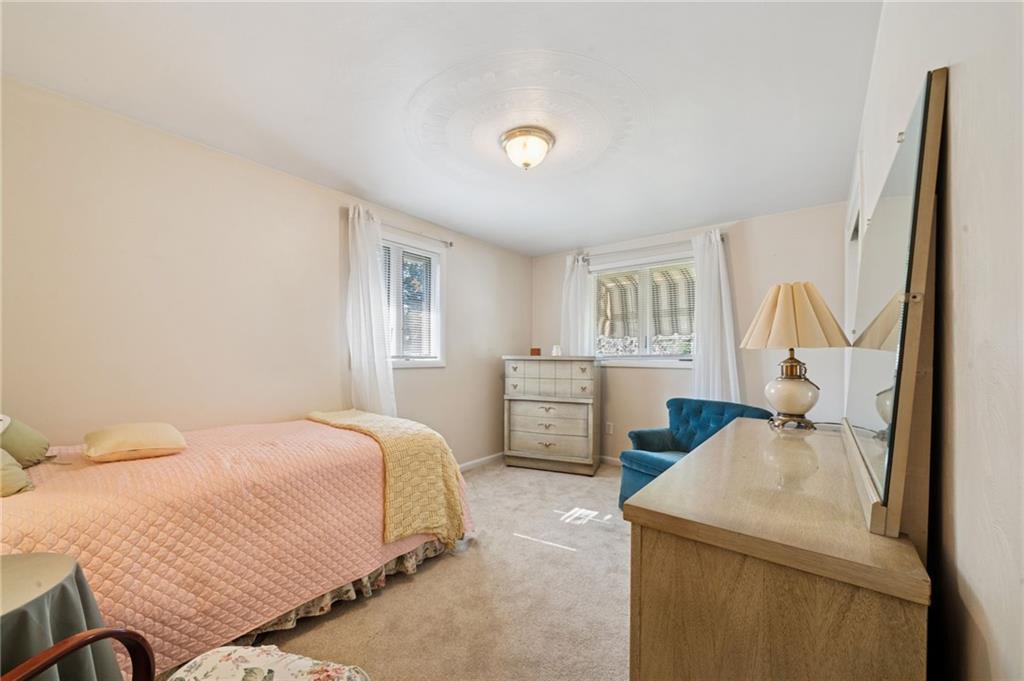 1722 Arona Road Irwin, PA 15642 - Photo 24 of 33 a bedroom with a bed next to a window with storage