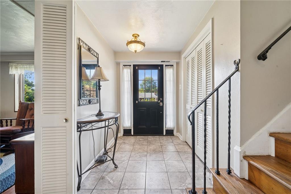 1722 Arona Road Irwin, PA 15642 - Photo 4 of 33 a view of a hallway with wooden floor and staircase
