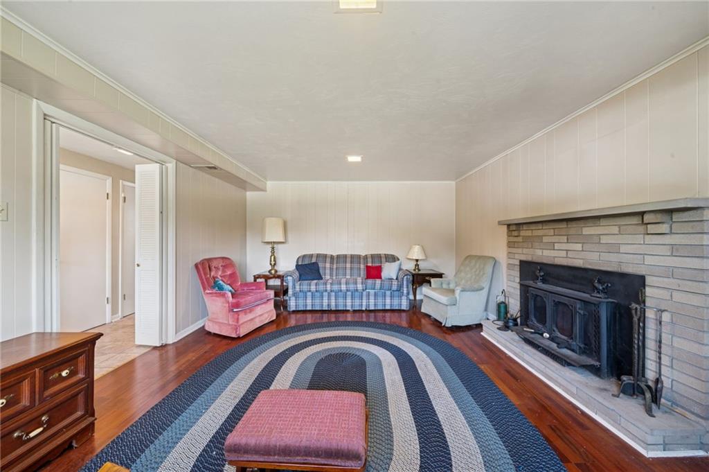 1722 Arona Road Irwin, PA 15642 - Photo 5 of 33 a living room with furniture and a fireplace