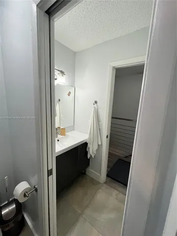 a bathroom with a sink and mirror