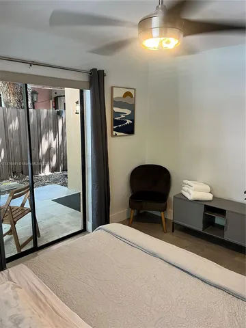 a bedroom with a bed and a mirror