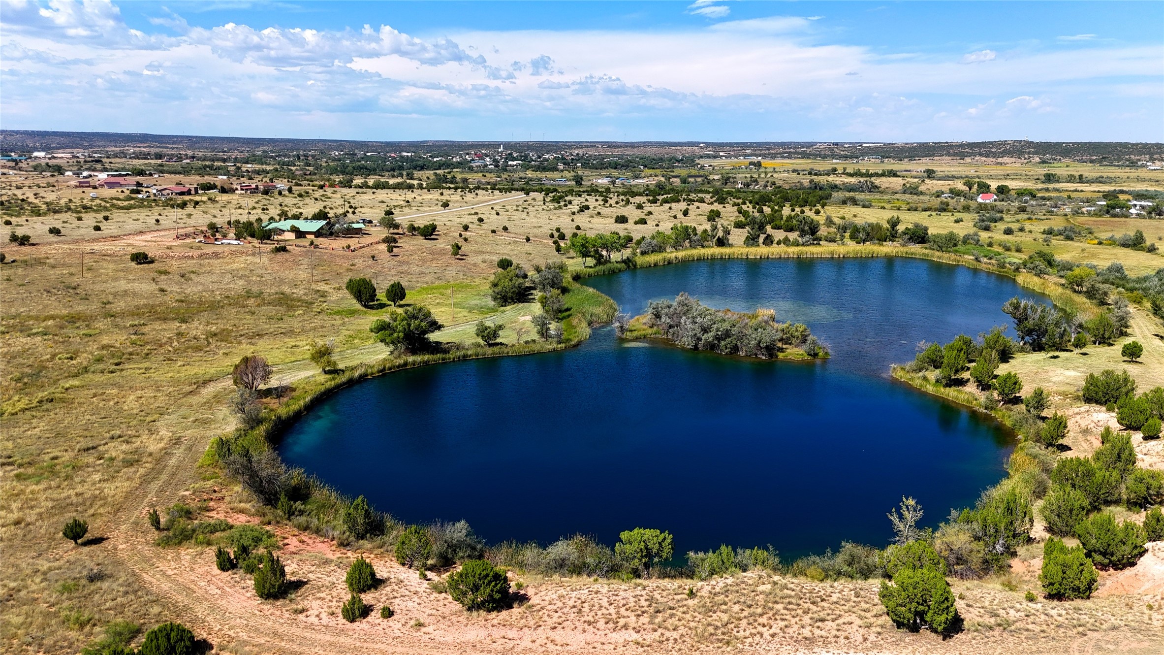 Beautiful blue water hole with bass lake!