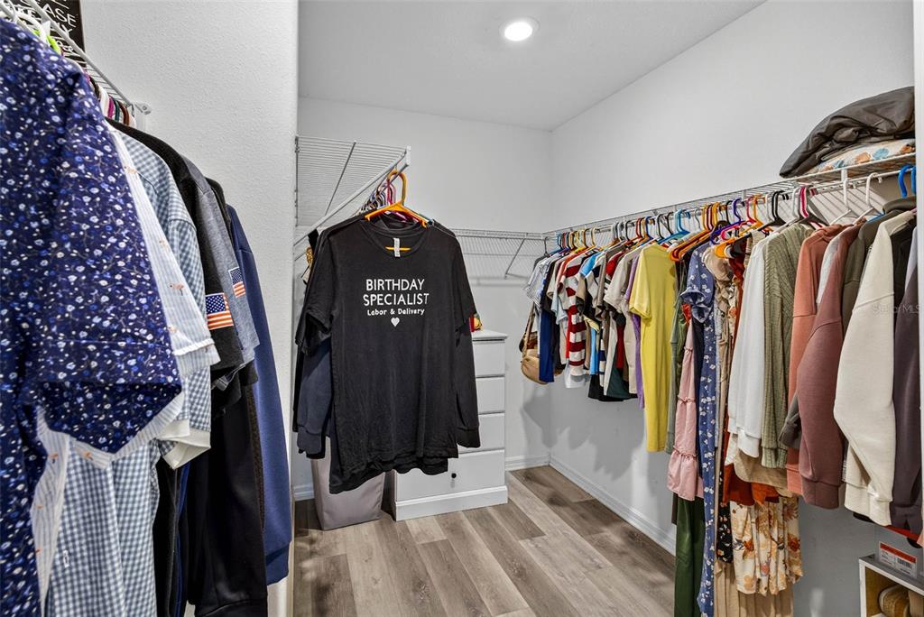 9616 Lemon Drop Loop Sun City Center, FL 33573 - Photo 26 of 53 a view of walk in closet with clothes