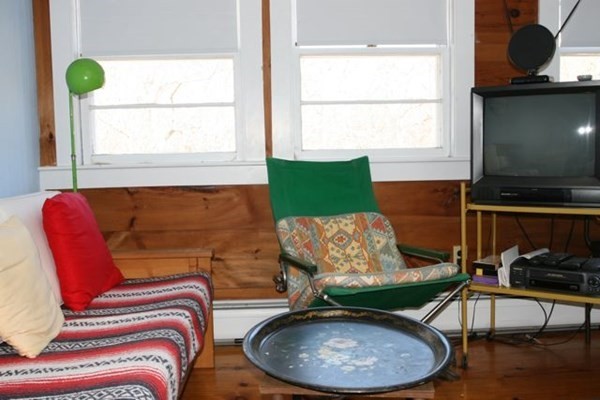 44 Flanders Lane Chilmark, MA 02535 - Photo 11 of 19 a living room with a couch and a table