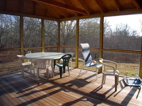 a view of a patio with a table chairs and a table