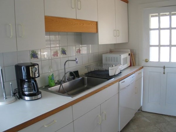 44 Flanders Lane Chilmark, MA 02535 - Photo 2 of 19 a kitchen with sink and cabinets