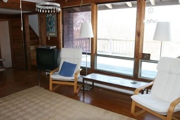 a living room with furniture and a window