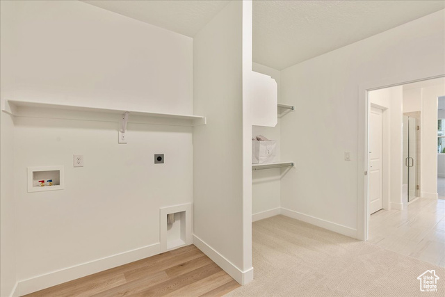 2033 Fortune Lane, Unit 462 Mapleton, UT 84664 - Photo 20 of 27 Laundry room featuring washer hookup, hookup for an electric dryer, and light hardwood / wood-style flooring