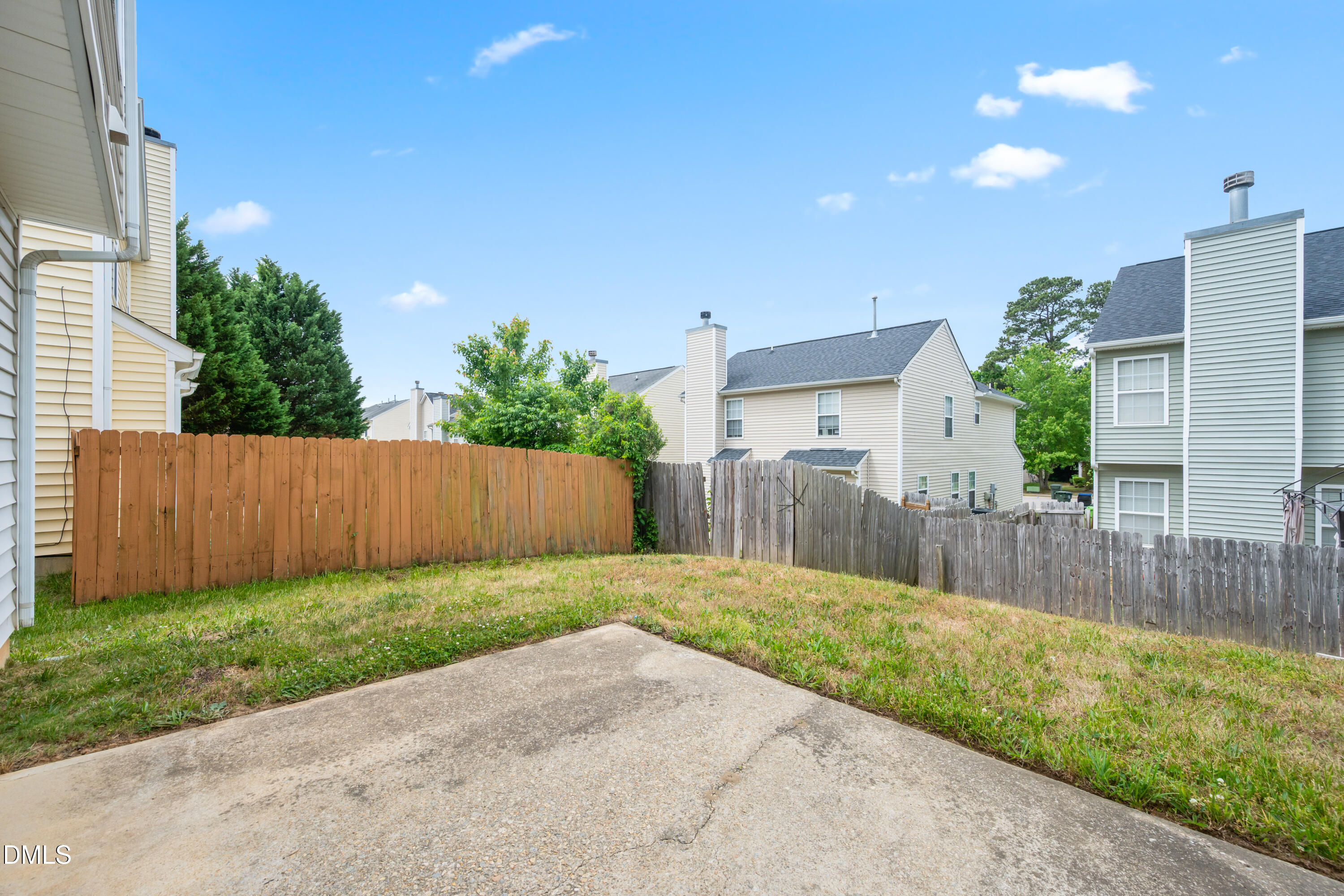 1532 Pebble Ridge Drive Raleigh, NC 27610 - Photo 38 of 40 front view of a house with a yard and potted plants