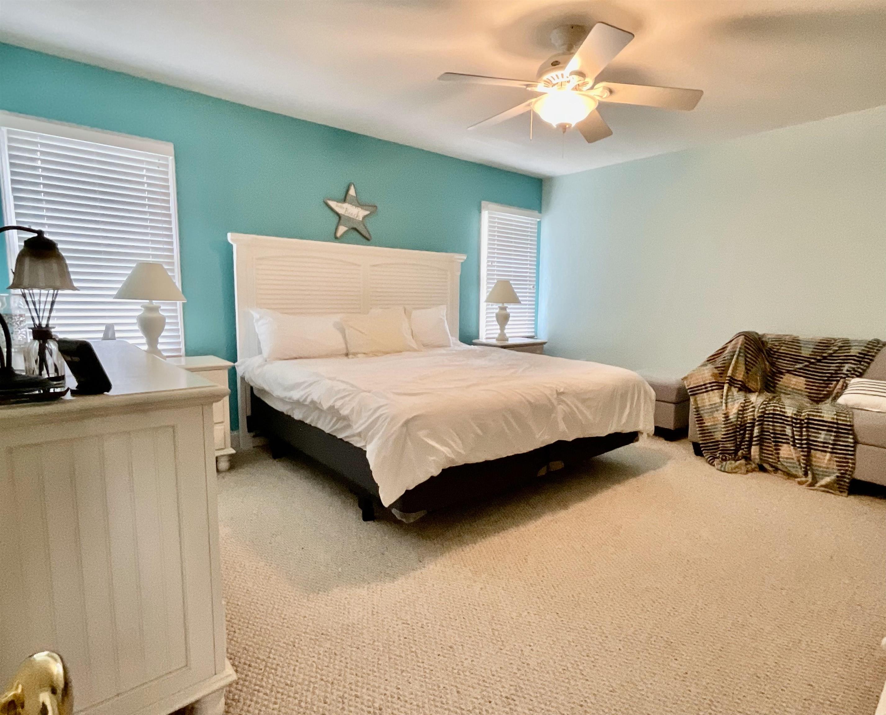 124 Gables Way Kitty Hawk, NC 27949 - Photo 22 of 37 Upstairs primary bedroom with double closets and n
