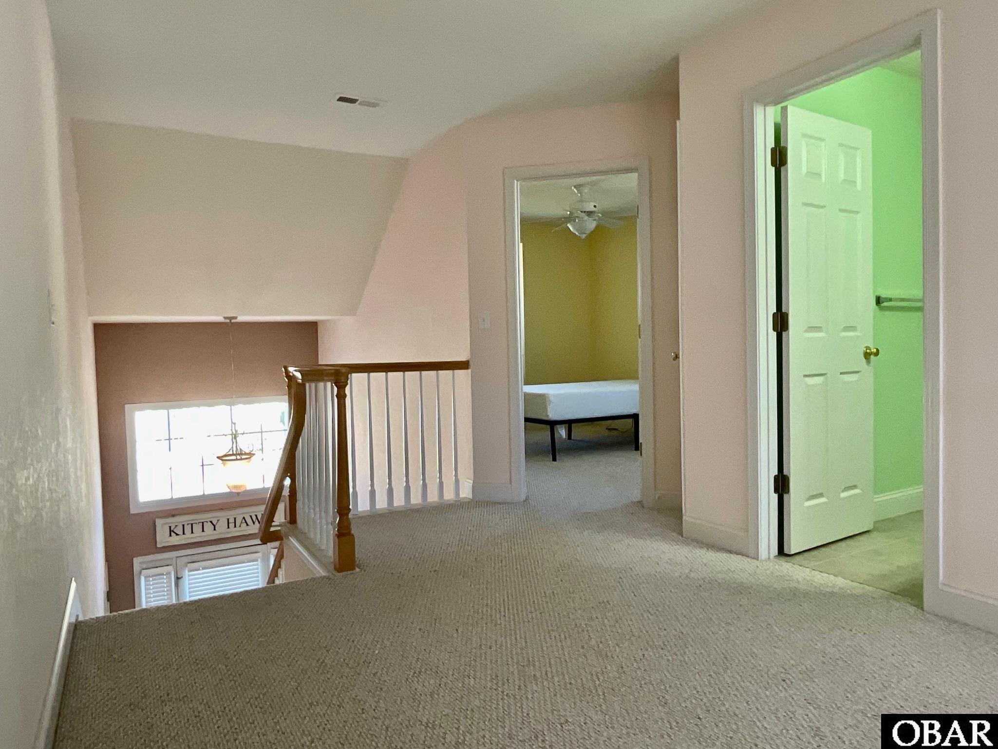 124 Gables Way Kitty Hawk, NC 27949 - Photo 31 of 37 Spacious are between bedrooms