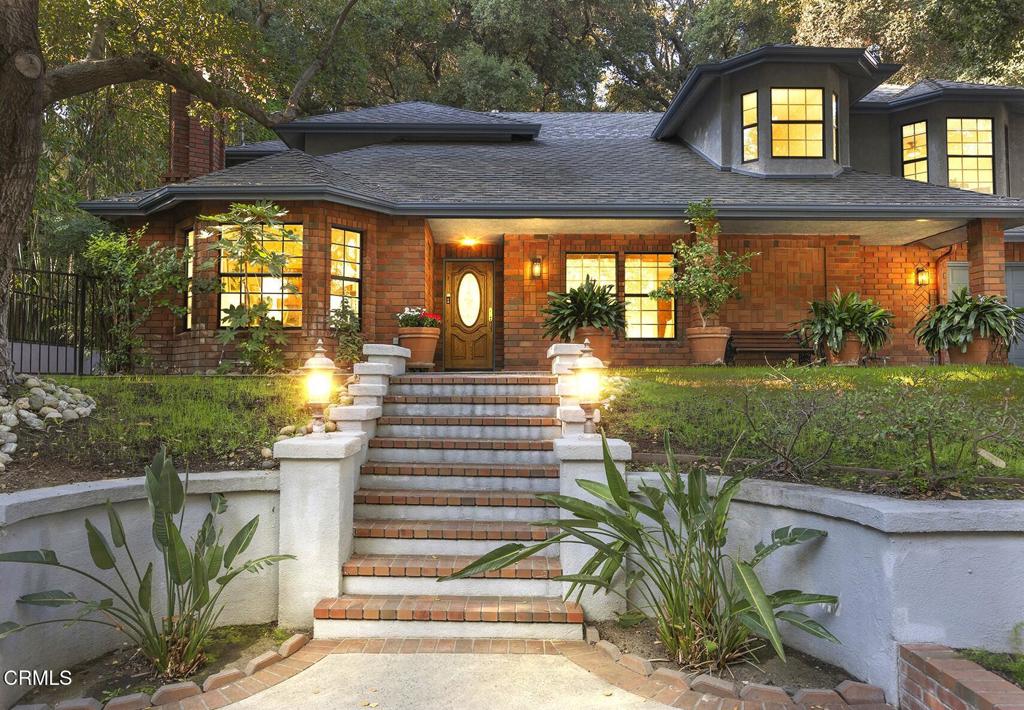 23 Hidden Valley Road Monrovia, CA 91016 - Photo 1 of 27 a view of a house with a small yard plants and large tree