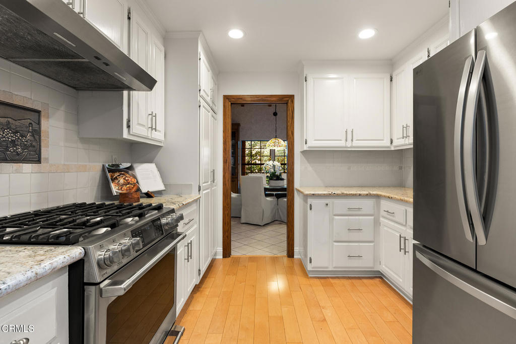 23 Hidden Valley Road Monrovia, CA 91016 - Photo 12 of 27 a kitchen with a refrigerator and a stove