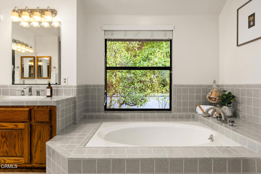23 Hidden Valley Road Monrovia, CA 91016 - Photo 19 of 27 a bathroom with a tub sink and window