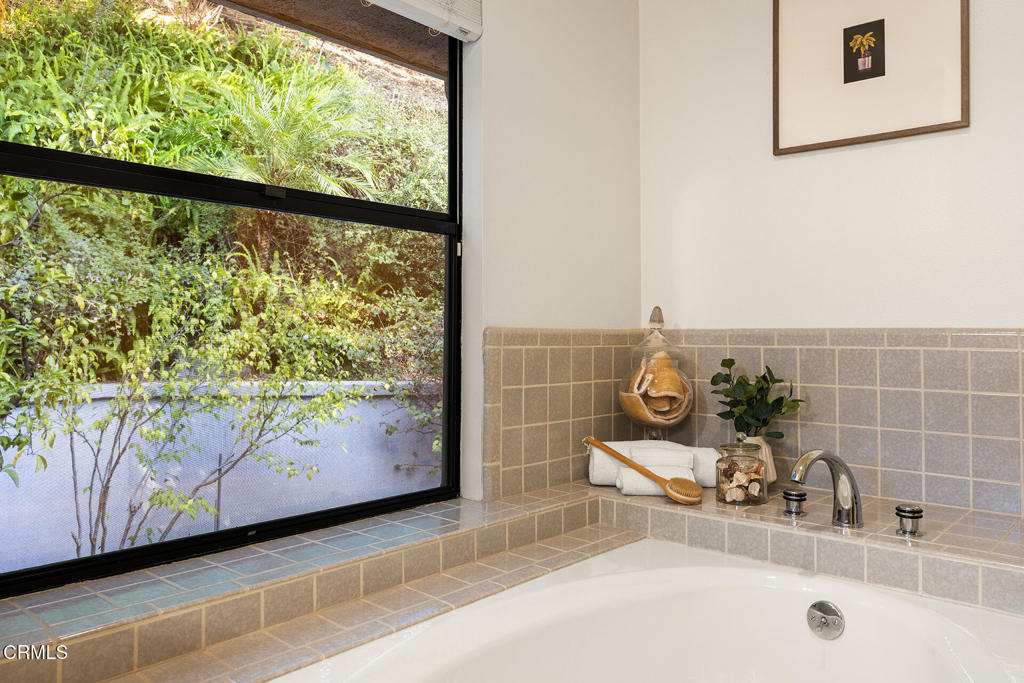 23 Hidden Valley Road Monrovia, CA 91016 - Photo 20 of 27 a bathroom with a double vanity sink and a window