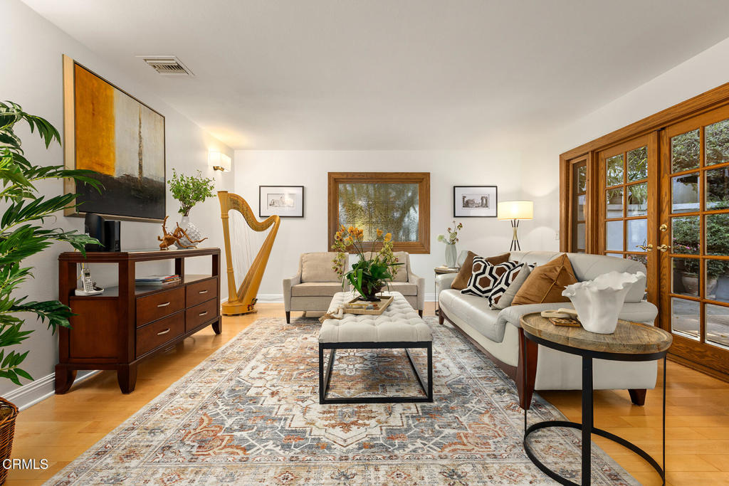 23 Hidden Valley Road Monrovia, CA 91016 - Photo 2 of 27 a living room with furniture a rug and a large window