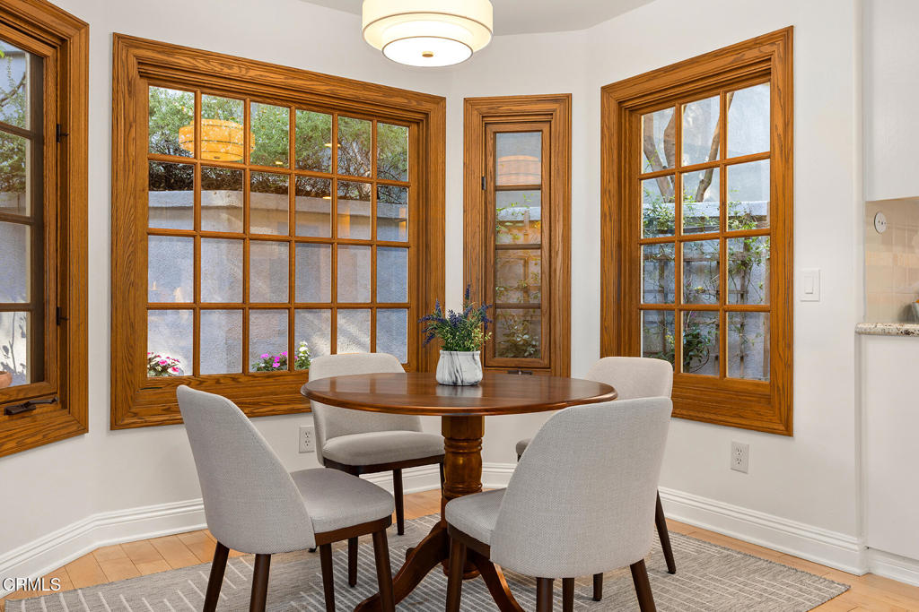 23 Hidden Valley Road Monrovia, CA 91016 - Photo 9 of 27 a dining room with furniture a chandelier and wooden floor