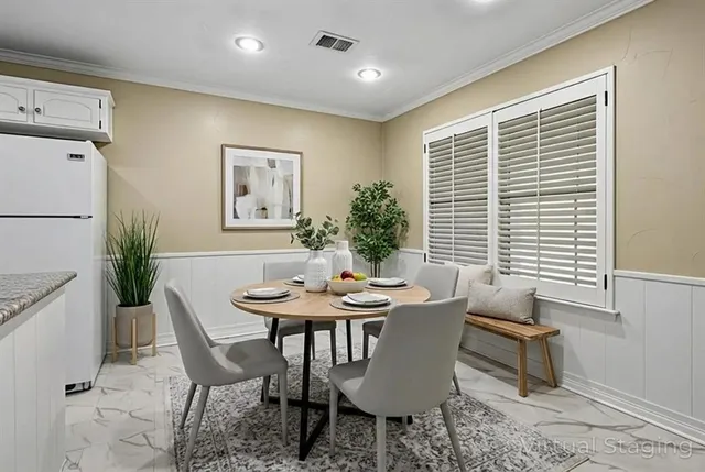 a dining room with furniture and window