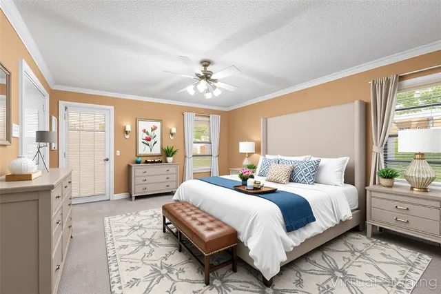 a spacious bedroom with a bed a chandelier and a couch