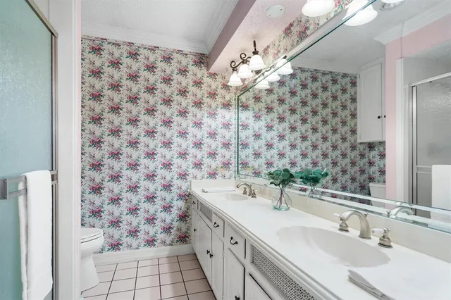a bathroom with a sink a vanity and a shower