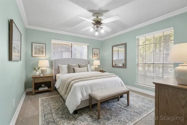 a bed room with a bed and a window