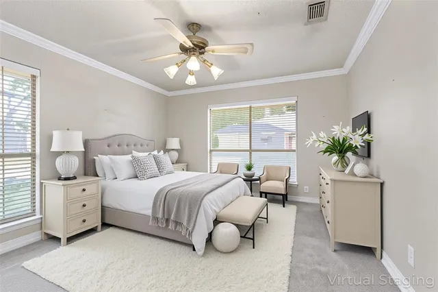 a bedroom with bed and a chandelier