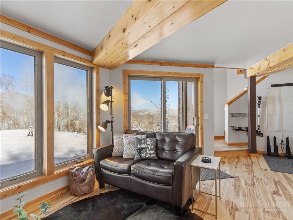 630 Briarcliff Road Sugar Mountain, NC 28604 - Photo 5 of 28 a living room with furniture and a large window
