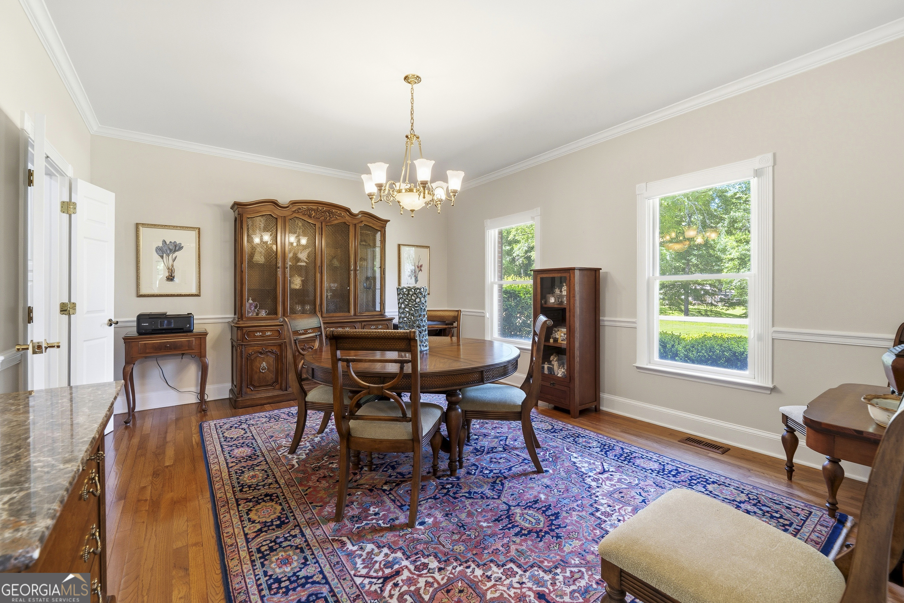 104 Spruce Point Southeast Eatonton, GA 31024 - Photo 11 of 63 a view of a dining room with furniture and wooden floor