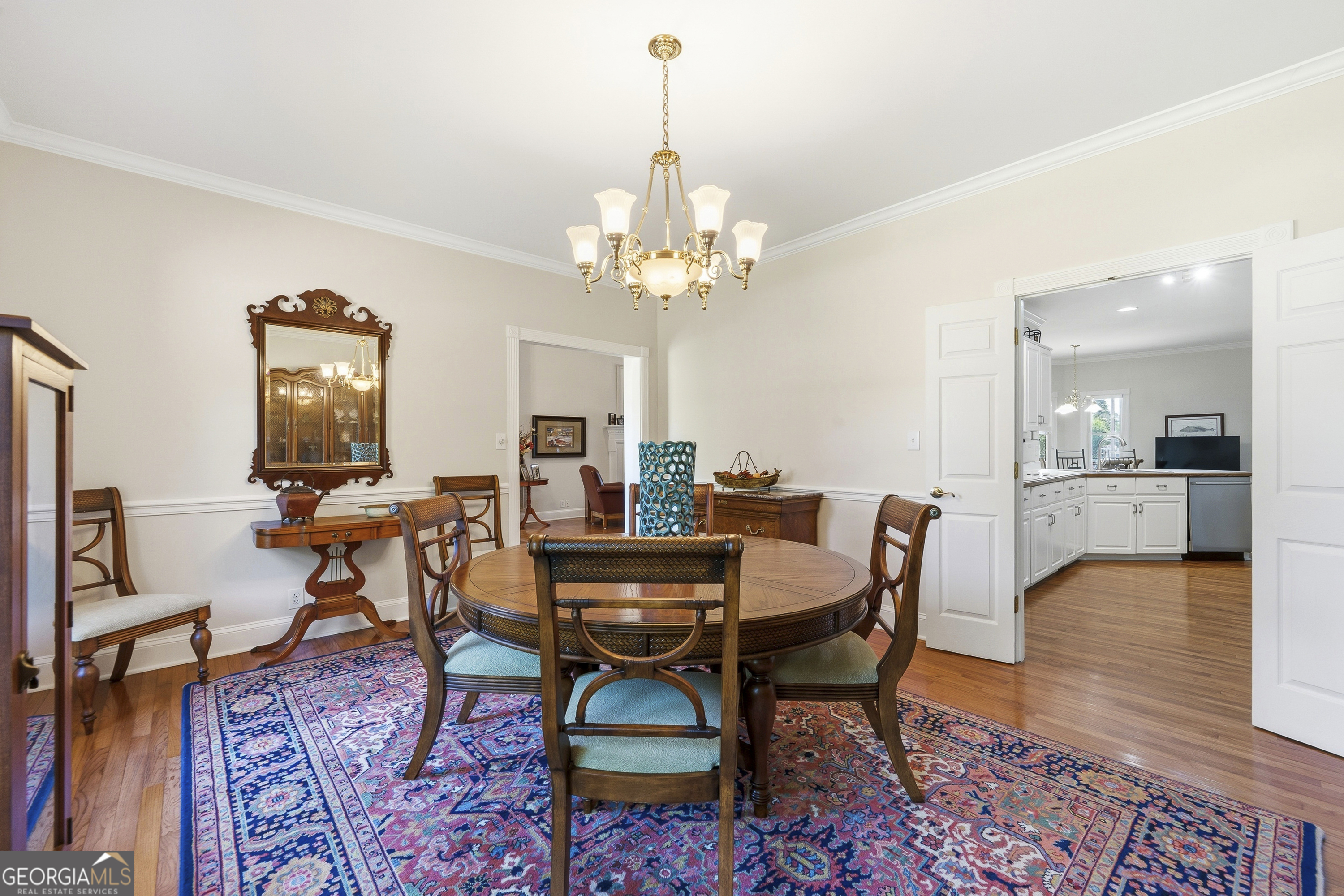 104 Spruce Point Southeast Eatonton, GA 31024 - Photo 12 of 63 a view of a dining room with furniture and wooden floor