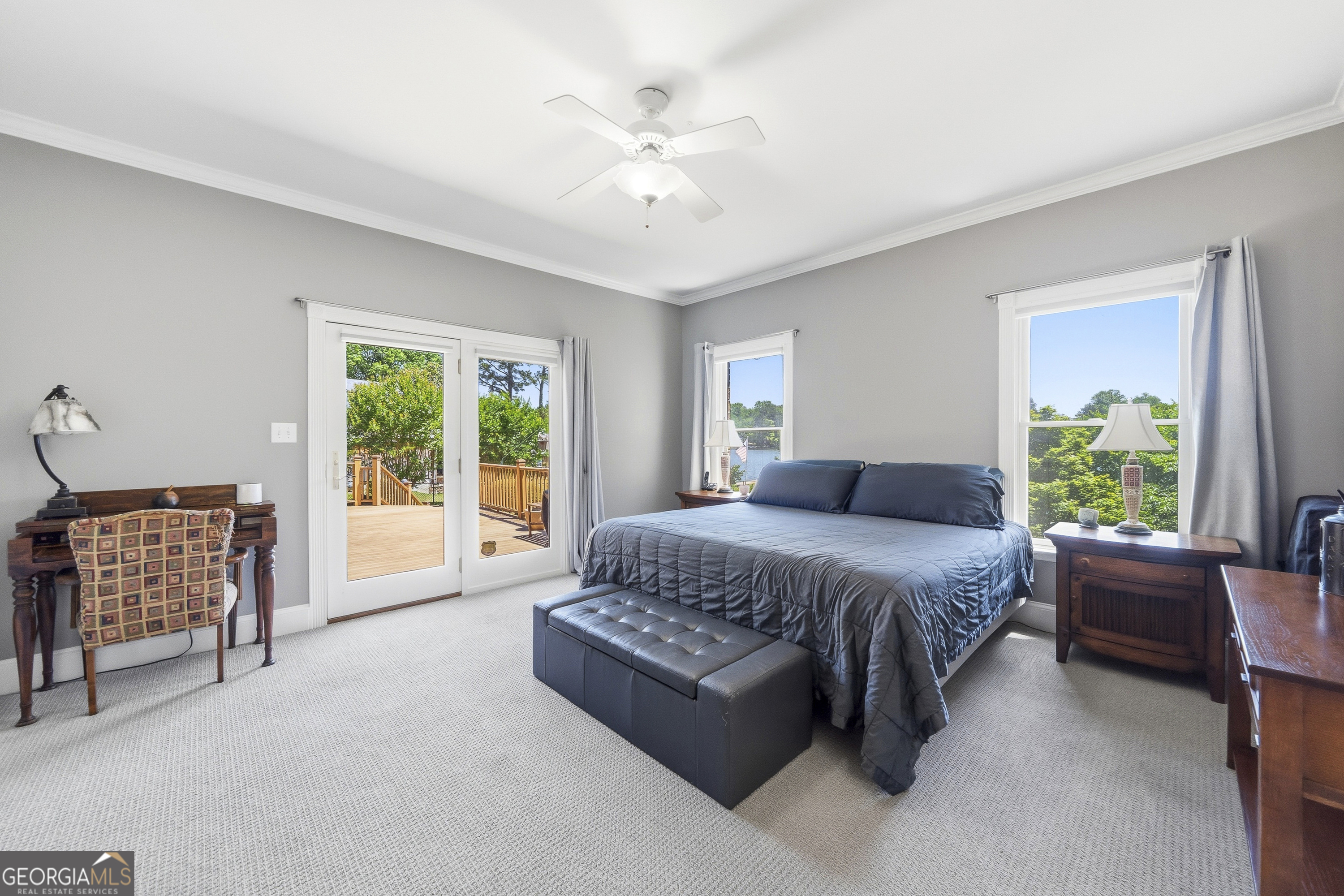 104 Spruce Point Southeast Eatonton, GA 31024 - Photo 24 of 63 a spacious bedroom with a bed and a couch