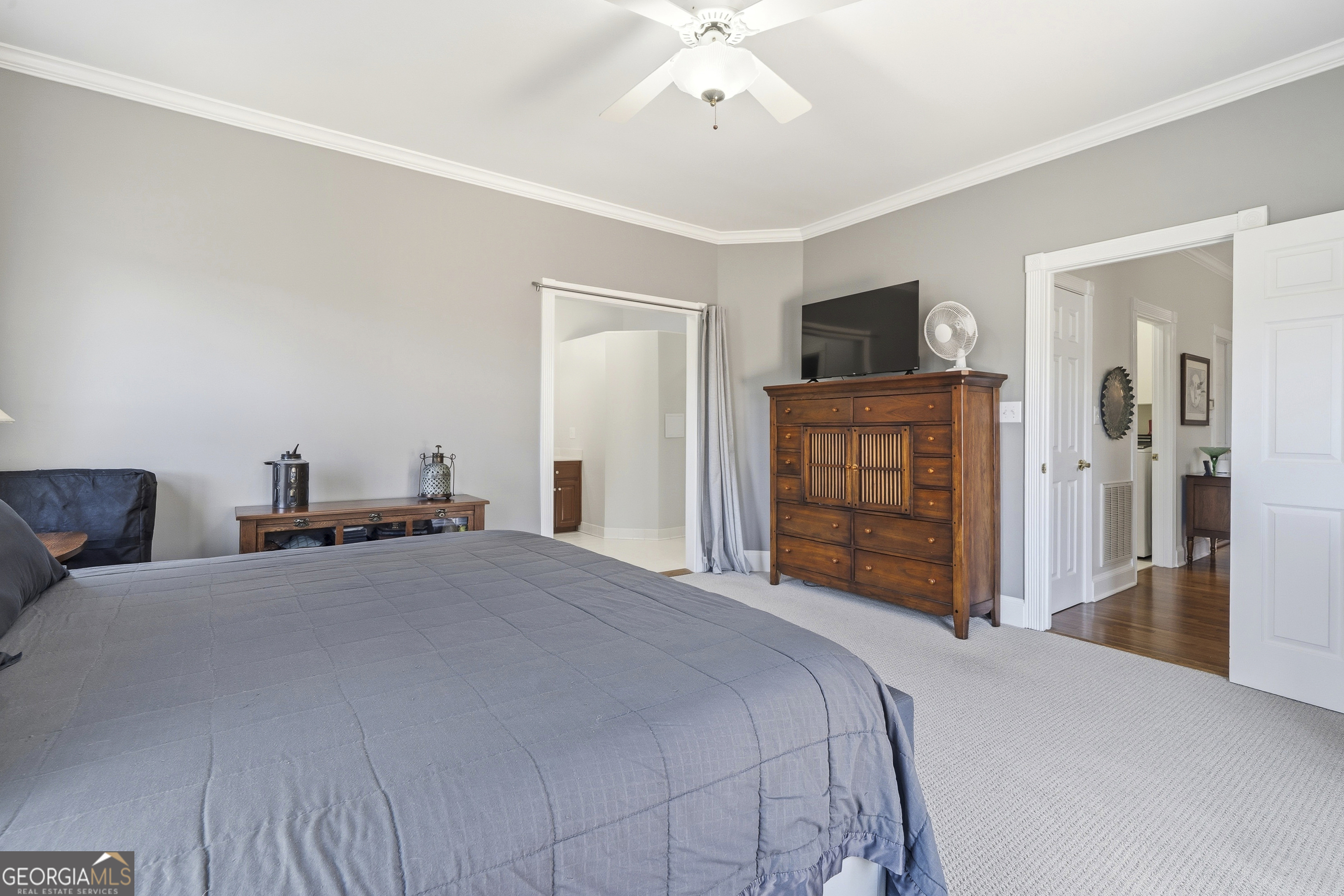 104 Spruce Point Southeast Eatonton, GA 31024 - Photo 25 of 63 a bedroom with a bed and a flat screen tv