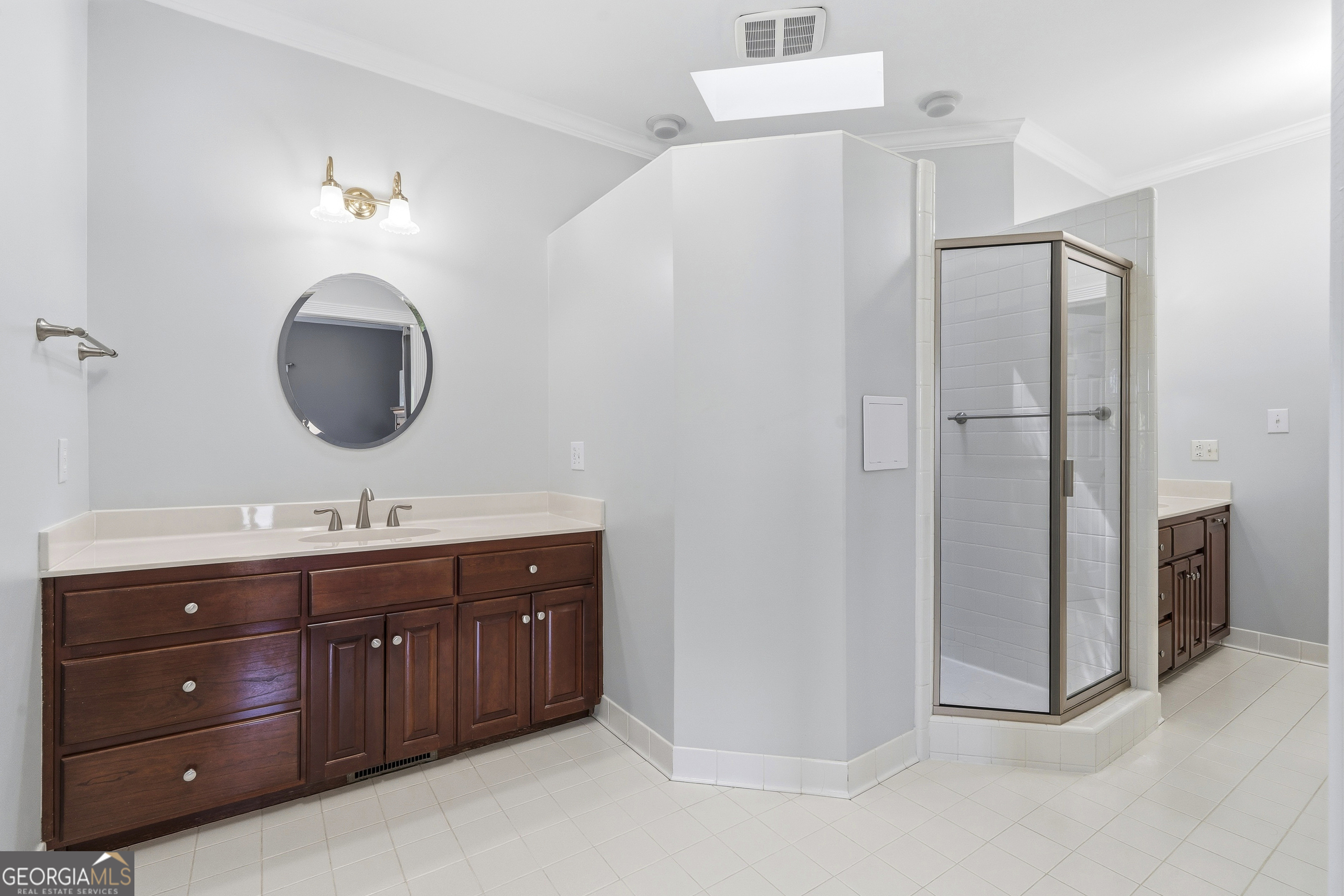 104 Spruce Point Southeast Eatonton, GA 31024 - Photo 26 of 63 a bathroom with a double vanity sink double and mirror